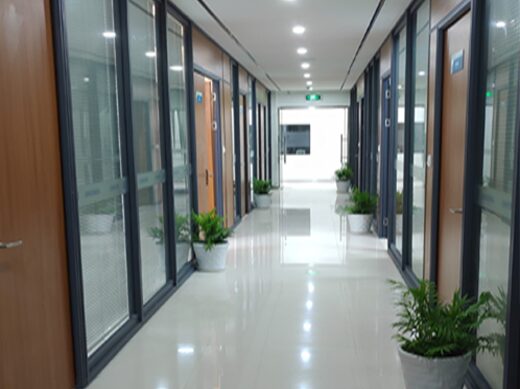 Office corridor with glass partitions